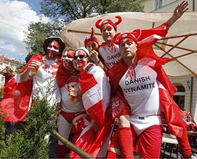 Denmark soccer fans drink beer and sing in Lviv